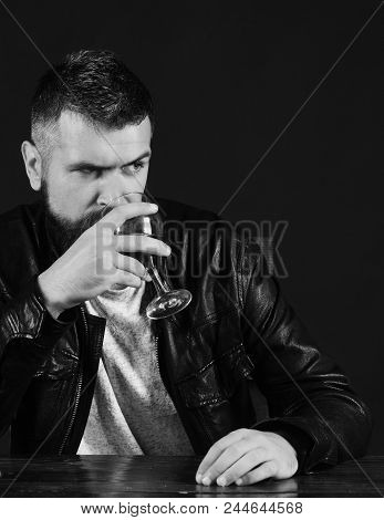 Degustator With Busy Face Drinks Wineglass. Sommelier Tastes Expensive Drink. Man With Beard Holds G