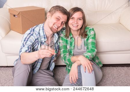 Young Woman With Boxes And Holding Flat Keys