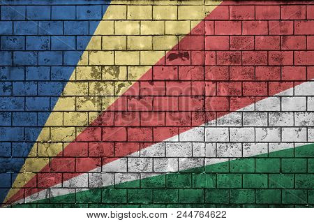 Seychelles Flag Is Painted Onto An Old Brick Wall