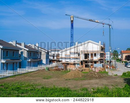 Rovigo, Italy - June, 9, 2018: cranes work on construction in Rovigo, Italy