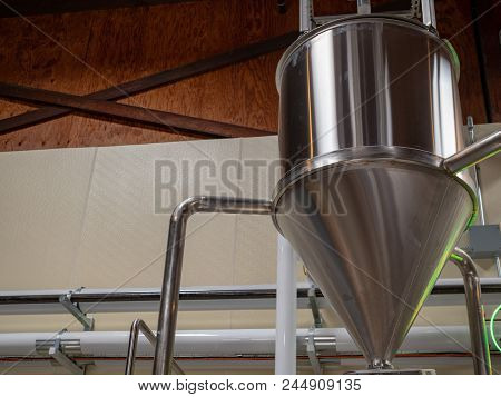 A Cone Shaped Fermentation Tank At A Brewery