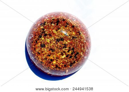 Orgonite Healing Crystal And Metal Sawdust On Paper Background