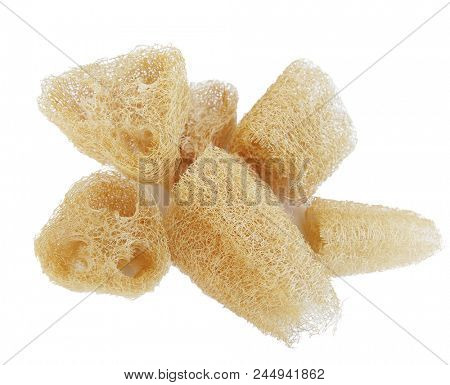 Heap of natural luffa scrubbing sponges isolated on white background