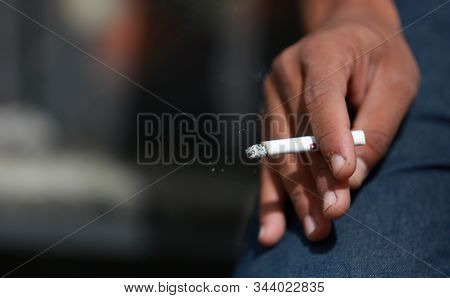 Salvador, Bahia / Brazil - May 29, 2015: Young Man Is Seen Smoking A Cigarette In The City Of Salvad