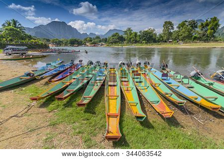 Long Tail Boats On Song River In Vang Vieng, Laos.