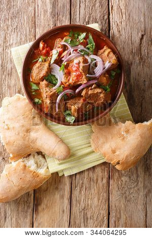 Spicy Georgian Beef Stew Chashushuli Ostri Close-up In A Bowl. Vertical Top View