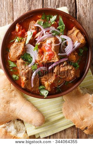 Veal Chashushuli In Spicy Tomato Onion Sauce Close-up In A Bowl. Vertical Top View