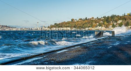 Waves Crash Onto The Shore At Alki Beach In West Seattle, Washington.