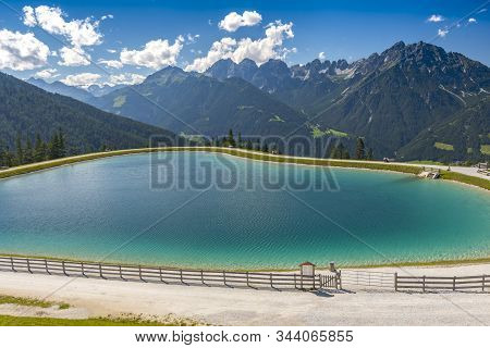 One Of The Man Made Lakes Near Serles Park Next To The Mountain Station, Mieders, Austria.