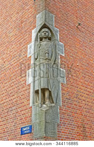 Amsterdam, Netherlands - June 11, 2016: Wall Statue Of The Bistro Berlage Historic Building In City 