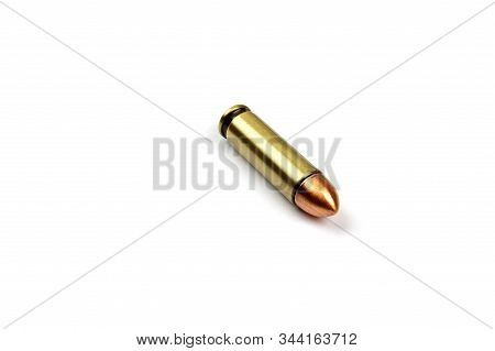 One Single Pistol Bullet On A White Background