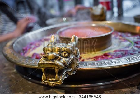 Chengdu Sichuan Hot Pot Close Up With Dragon Head Sculpted Handles, Chenggdu, Sichuan Province, Chin
