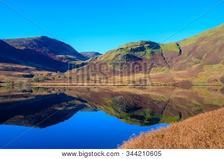 View Across Crummock Water Looking Towards Mellbreak And Scale Knott In The Lake District,cumbria,uk