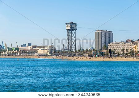 Barcelona, Spain - November 2, 2019: Beach Platja De St.sebastia And A Free Standing Lattice Tower T