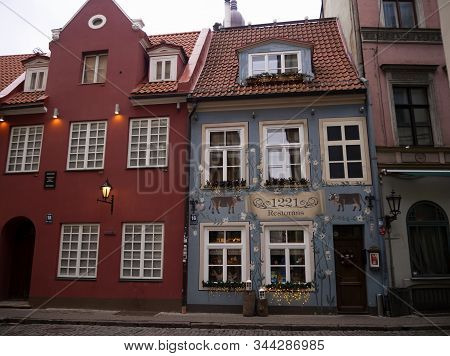 Famous Riga Restaurant 1221 With Cows Painted On The Facade In Christmas Decorations, A Historical A