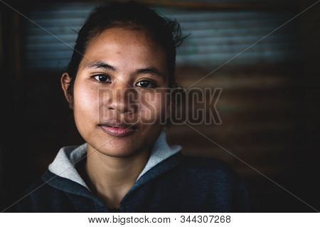 Sangkat Krabei Riel, Siem Reap Province, Cambodia - 4 April 2013: Young Cambodian Woman In Jumper In