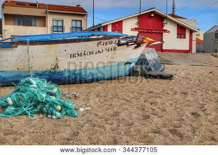 Miramar, Porto, Portugal- January 8, 2020: Colorful Fishing Boats Damaged By Storm Stranded On Aguda