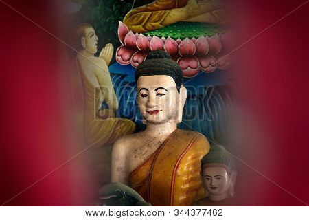 Sangkat Krabei Riel, Siem Reap Province, Cambodia - 4 April 2013: Red Colorful Framed Buddha Statue 