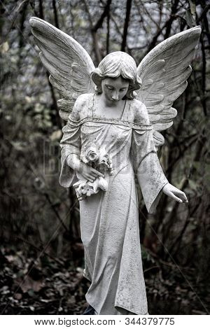 Statue Of A Mourning Angel On A Graveyard
