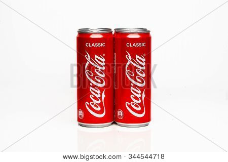 Moscow, Russia - 15.11.2019 : Three Cans Of Coca-cola. Two Are Standing And One Is Laying