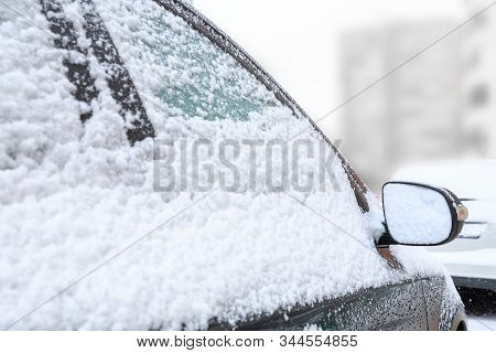 Car Mirror In The Snow Close-up. Side Mirror Of Vehicle. Car Standing In Snow. Snowdrift Snow By Veh