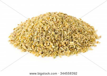Heap Of Uncooked, Raw Freekeh Or Firik, Roasted Wheat Grain Over White Background
