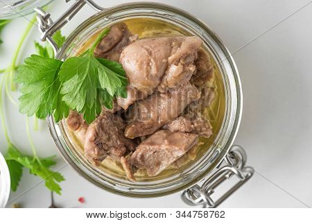 Cod Liver In A Jar With Parsley. Natural Source Of Omega 3 And Vitamin D. Top View With Copy Space