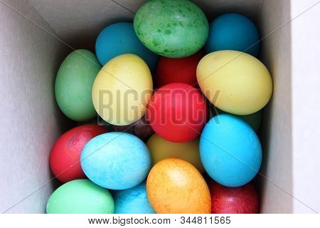 Lots Of Multi-colored Easter Eggs In A White Square Box. Easter Preparations. Painting Eggs.