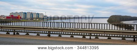 Landscape with the image of the bridge over Volhov river near the town Kirishy in Russia