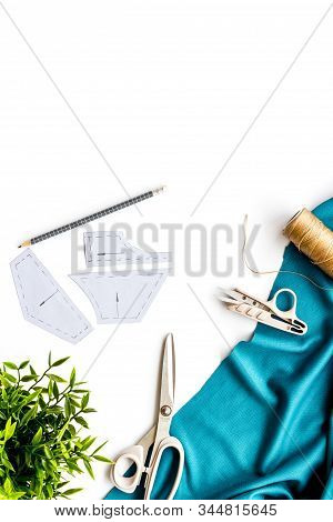 Sewing Wokrshop. Textile, Pattern, Scissors, Thread On White Background Top-down Copy Space