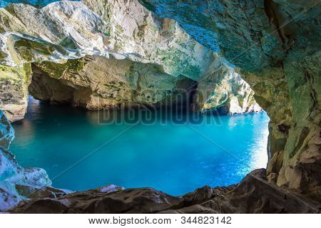  Karst cave Rosh-a-Nikra on the shores of the Mediterranean Sea. Israel. The color of sea water changes from azure to dark blue. The concept of active, environmental and photo tourism
