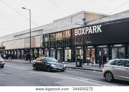 London, Uk - December 29, 2019: People And Cars In Front Of Shops At Boxpark Shoreditch, London, Shi