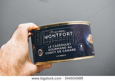 Paris, France - Jan 5, 2020: Man Hand Holding Against Gray Background Metallic Canning Preserves Man