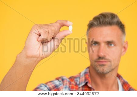 Vitamin Pill In Hand. Side Effects. Medicines Concept. Hemp Derived Cbd. Food Additives Vitamins For
