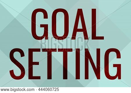 Hand Writing Sign Goal Setting. Internet Concept Dream Big Motivational Advice Or Reminder To Take A