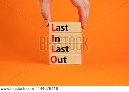 Lilo Last In Last Out Symbol. Concept Words Lilo Last In Last Out On Wooden Blocks. Beautiful Orange