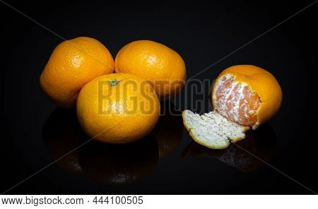 Ripe Yellow Tangerines Or Mandarins Fruit On Black Background. Idea Clementines Dieta