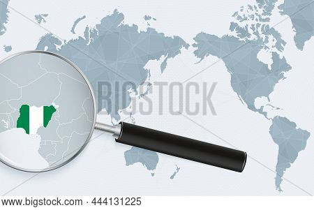 Asia Centered World Map With Magnified Glass On Nigeria. Focus On Map Of Nigeria On Pacific-centric 
