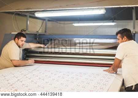 Technician Works On Large Industrial Textile Sublimation Heat Printing Machine
