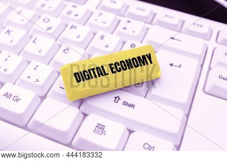 Handwriting Text Digital Economy. Word For Worldwide Network Of Economic Activities And Technologies