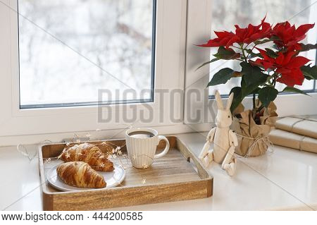 Freshly Baked Croissant On A Gray Round Plate, A White Cup Of Coffee And A Garland On A Tray On The 