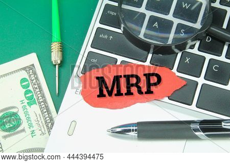Laptop Keyboard, Arrows, Colored Paper With Mrp Letters Or Material Requirements Planning