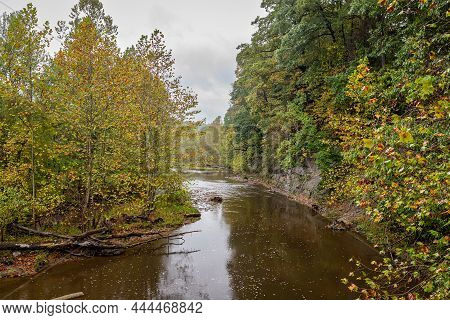 The West Bracnh Of Conneaut Creek Viewed From The Middle Road Covered Bridge During The Autumn Leaf 