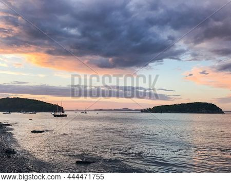 Sailboats In Frenchman's Bay In Bar Harbor, Maine At Sunset With A Storm Rolling In