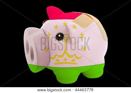 Konkurs Sparschwein Rich In den Farben der Flagge Tadschikistans geschlossen mit Bandage