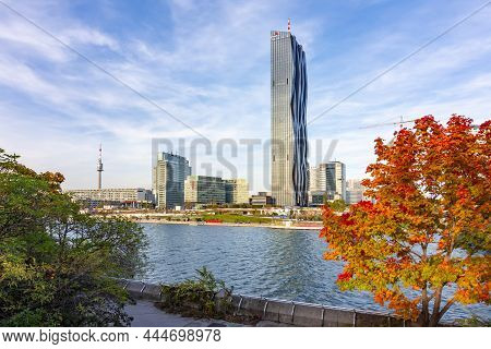 Vienna, Austria - October 2021: Pricewaterhousecoopers Skyscraper At Danube River In Autumn