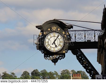 Historic Clock In High Street Of Old Town In Winchester, England
