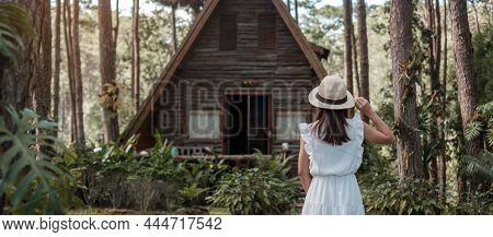 Happy Woman In White Dress And Hat Traveling In Pine Tree Forest, Tourist Visit At Doi Bo Luang, Chi