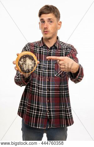 Young Handsome Tall Slim White Man With Brown Hair Pointing At Kolach In His Hand In Flannel Shirt I