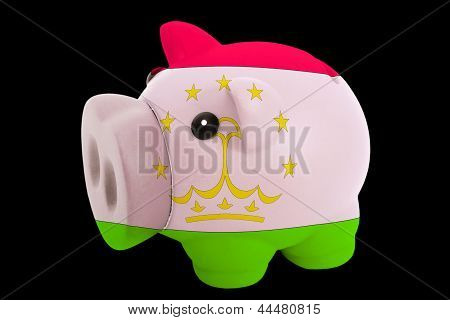 Reich Sparschwein In Farben Flagge Tadschikistan für Geld sparen